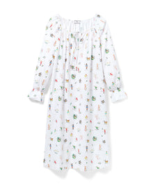 The Women's Twill Delphine Nightgown in 12 Days of Christmas is a white, long-sleeve nightgown with a gathered neckline, small bow tie, and a festive print inspired by the 12 Days of Christmas.