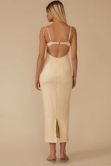 Cream textured slip dress with thin straps, open back cutout, and front slit, shown from back view.
