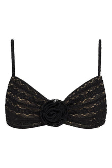 Black lace bikini top with daisy pattern, rosette center detail, and thin shoulder straps.