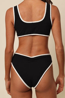 Black terry rib two-piece swimsuit with cream-colored binding on neckline, armholes, and waistband.