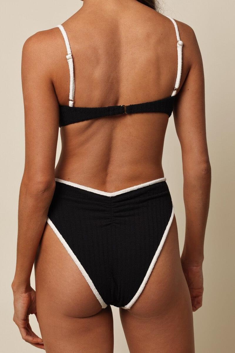 Black terry rib bikini bottom with cream binding trim on legs and waistband.