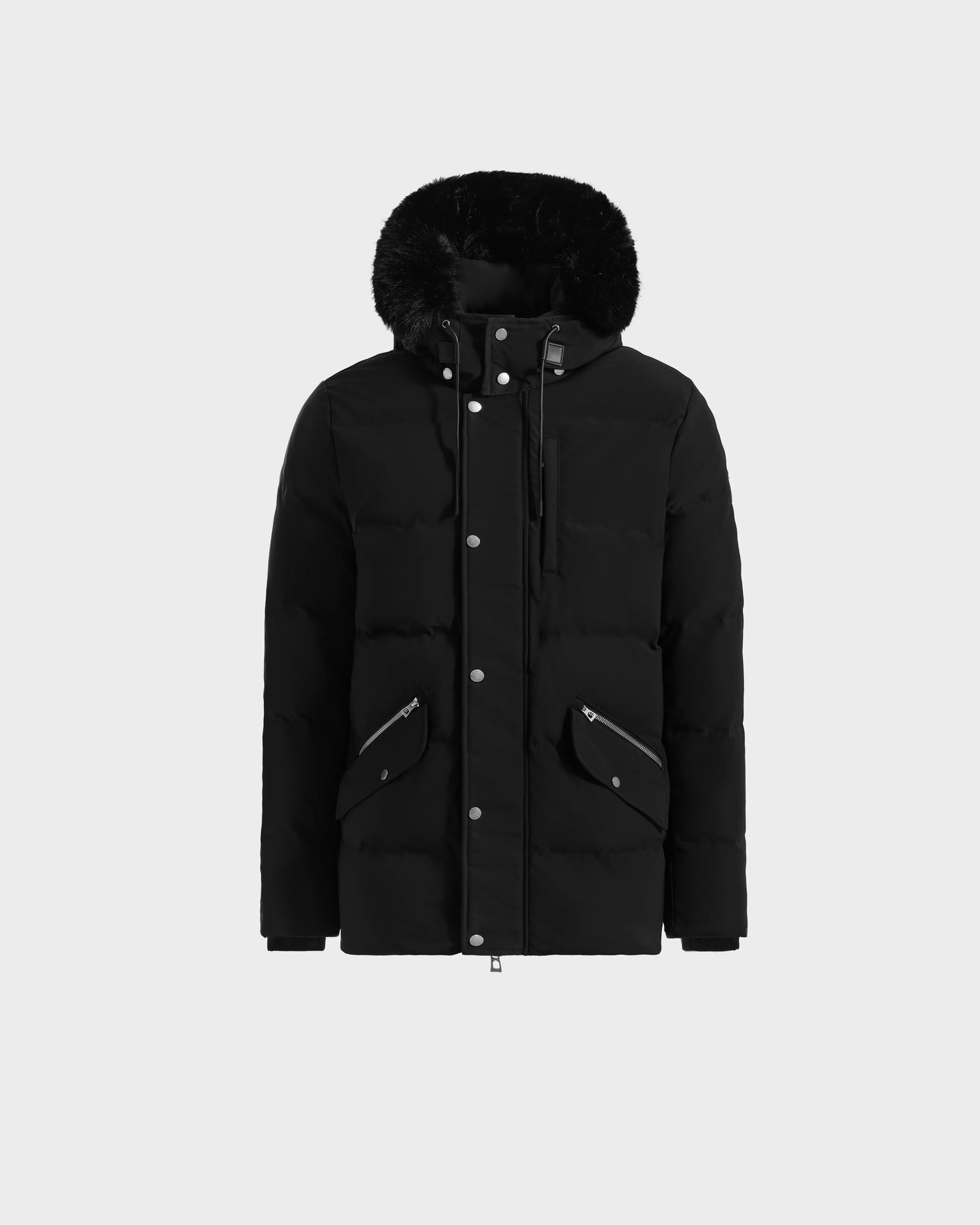 The Rudsak BRADY - M125510 Black men's parka features a classic quilted design, fur trim, front zipper and snaps, two zippered pockets, and a removable hood. Displayed against a plain light background.