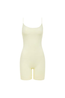 Cream-colored ribbed midi onesie with thin straps and scoop neckline.