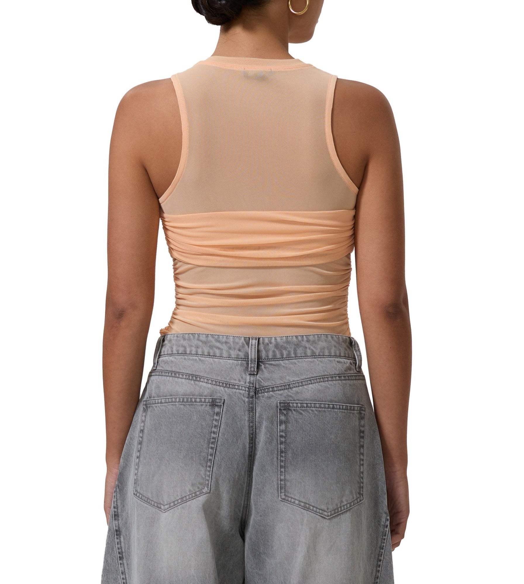 women's sleeveless top with illusion bandeau detail in peach fuzz