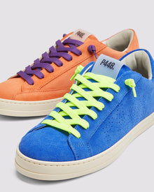 Back angle of the left blue sneaker with yellow laces and right orange sneaker with purple laces