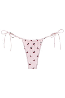 Pink bikini bottom with red cherry print and side tie straps with ruched waistband detailing.