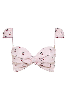 Light pink bikini top with red and dark cherry print throughout and a knotted bow front center.