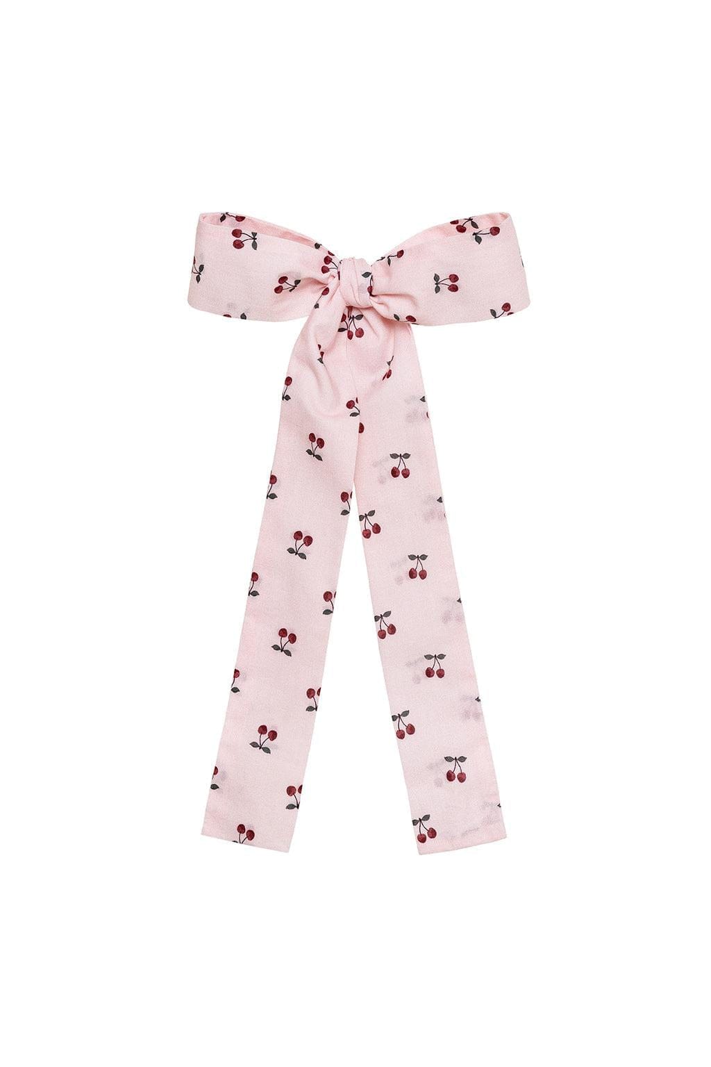 Pink hair ribbon with red and dark cherry print throughout and bow tie closure.