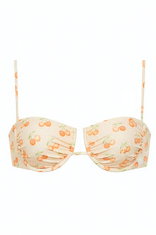 Cream bikini top with orange cherry print and striped shoulder straps, featuring ruched cup detailing.