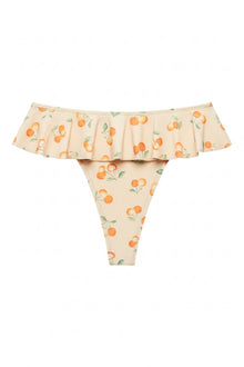 Cream bikini bottom with orange tamarindo fruit and green leaf print, featuring a ruffled off-shoulder waistband.