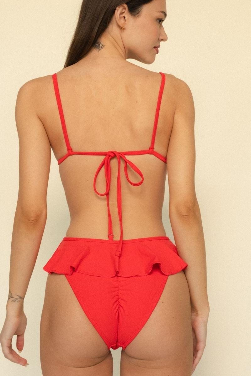 Red bikini top with thin straps and tie closure at back, shown from rear view.