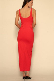 Woman wearing a red sleeveless scoop-neck maxi dress with fitted silhouette, shown from back view.