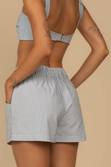 Blue and white striped boxer shorts with elastic waistband and side pockets.