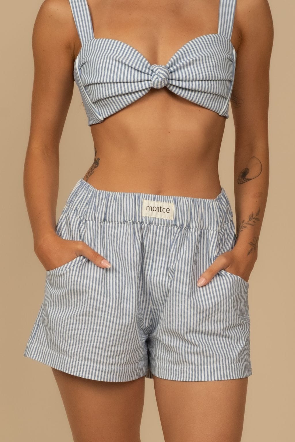 Blue and white striped boxer shorts with elastic waistband and side pockets.