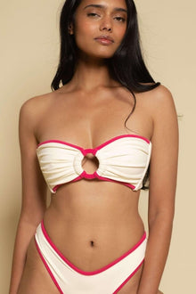 Cream and hot pink bandeau bikini top with center cutout and gathered ruching detail.