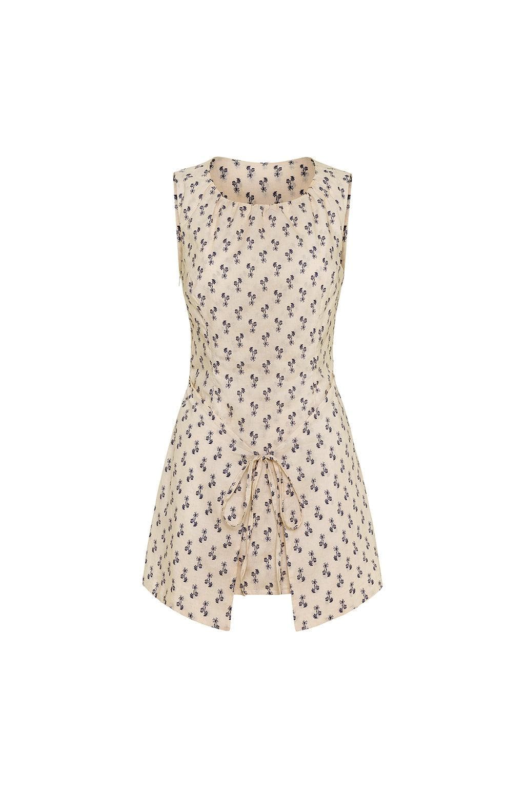 Sleeveless cream dress with small dark floral print and drawstring detail at center front hem.
