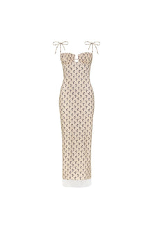 Cream slip dress with small black floral pattern, sweetheart neckline, tie shoulders, and white lace trim hem.