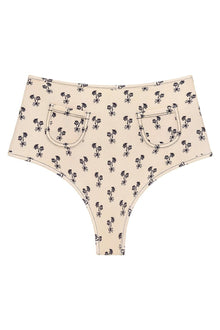 Cream bikini bottom with all-over black palm tree print and front patch pockets.