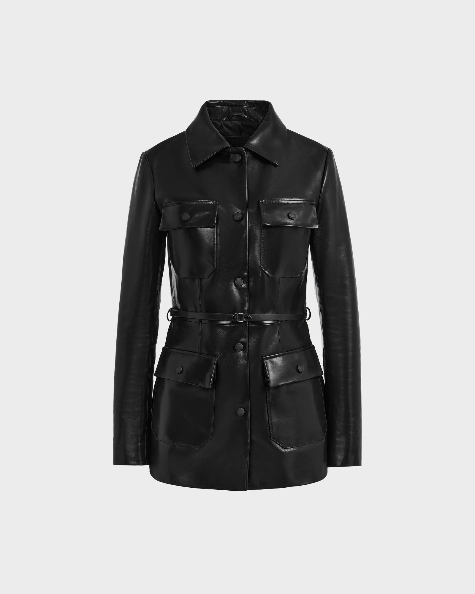 The Rudsak DANICA - 8125025 Black women’s leather jacket features a tailored fit, removable belt, button closure, and four front flap pockets, shown against a plain light gray background.