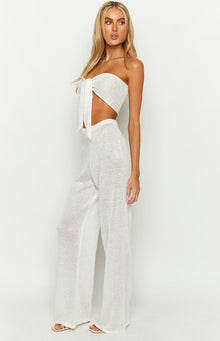 Side view of the white sequin knit wide-leg pants, highlighting the relaxed fit and shimmering texture