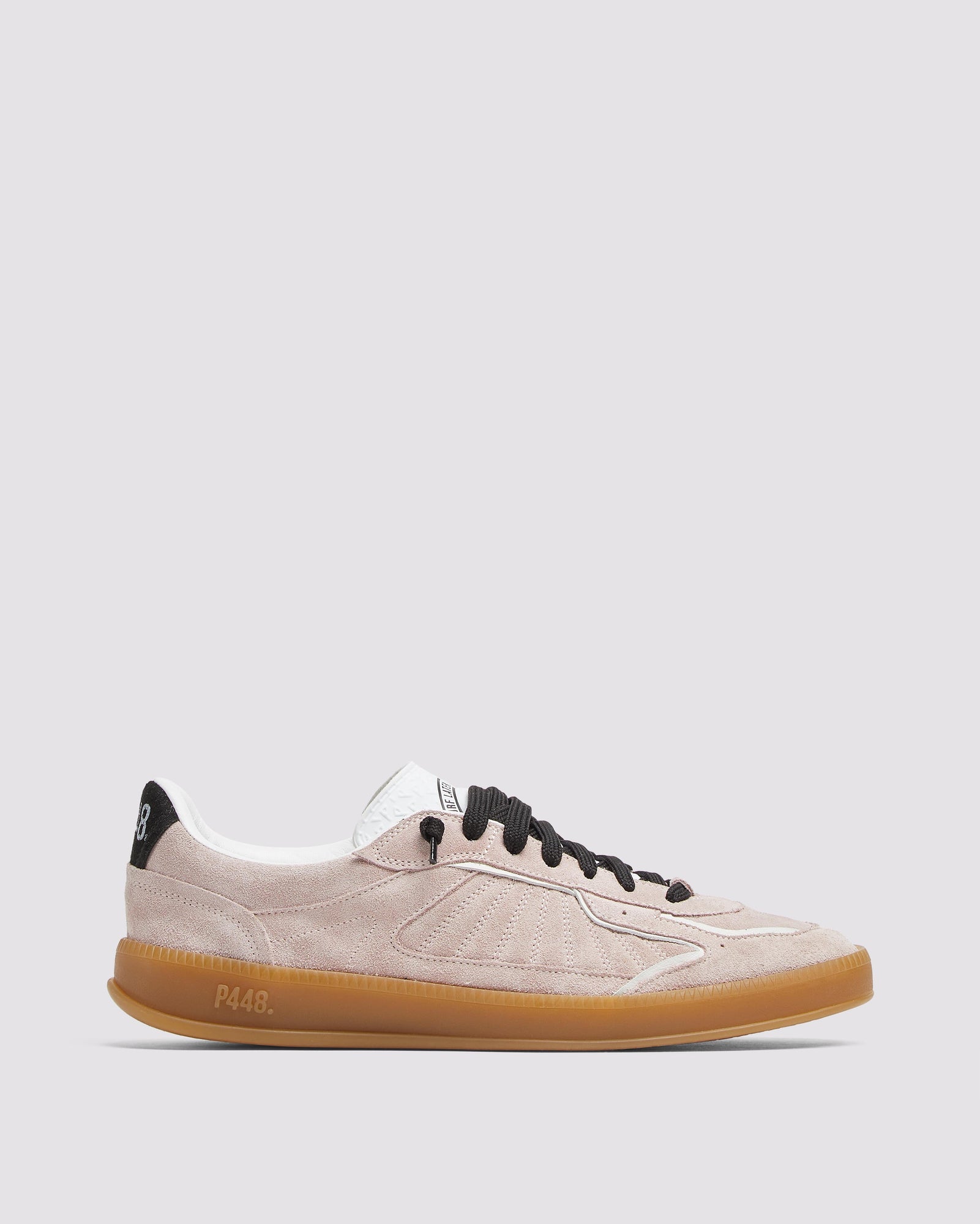 Side angle of light pink and black sneakers