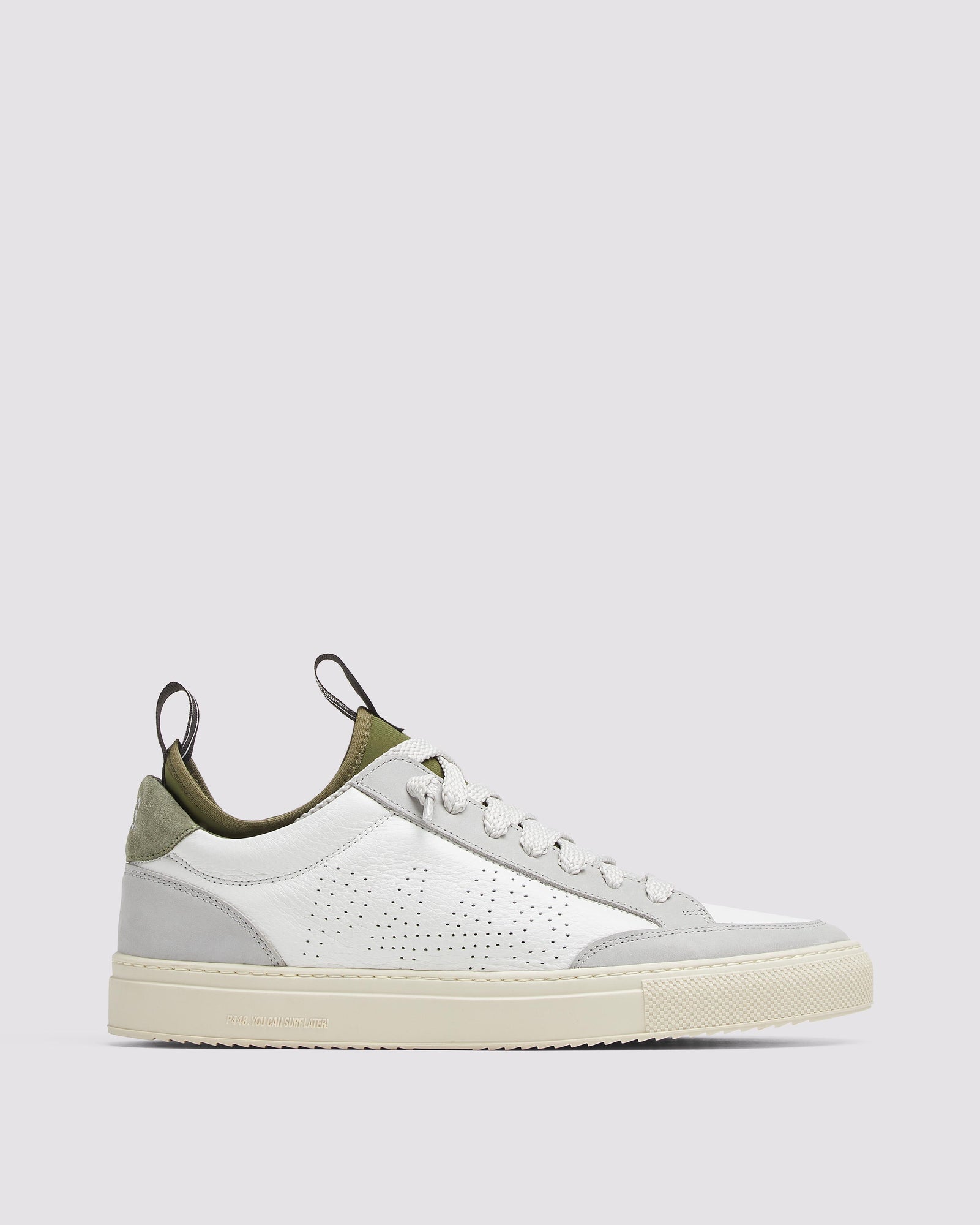 Side angle of white, grey and green sneakers