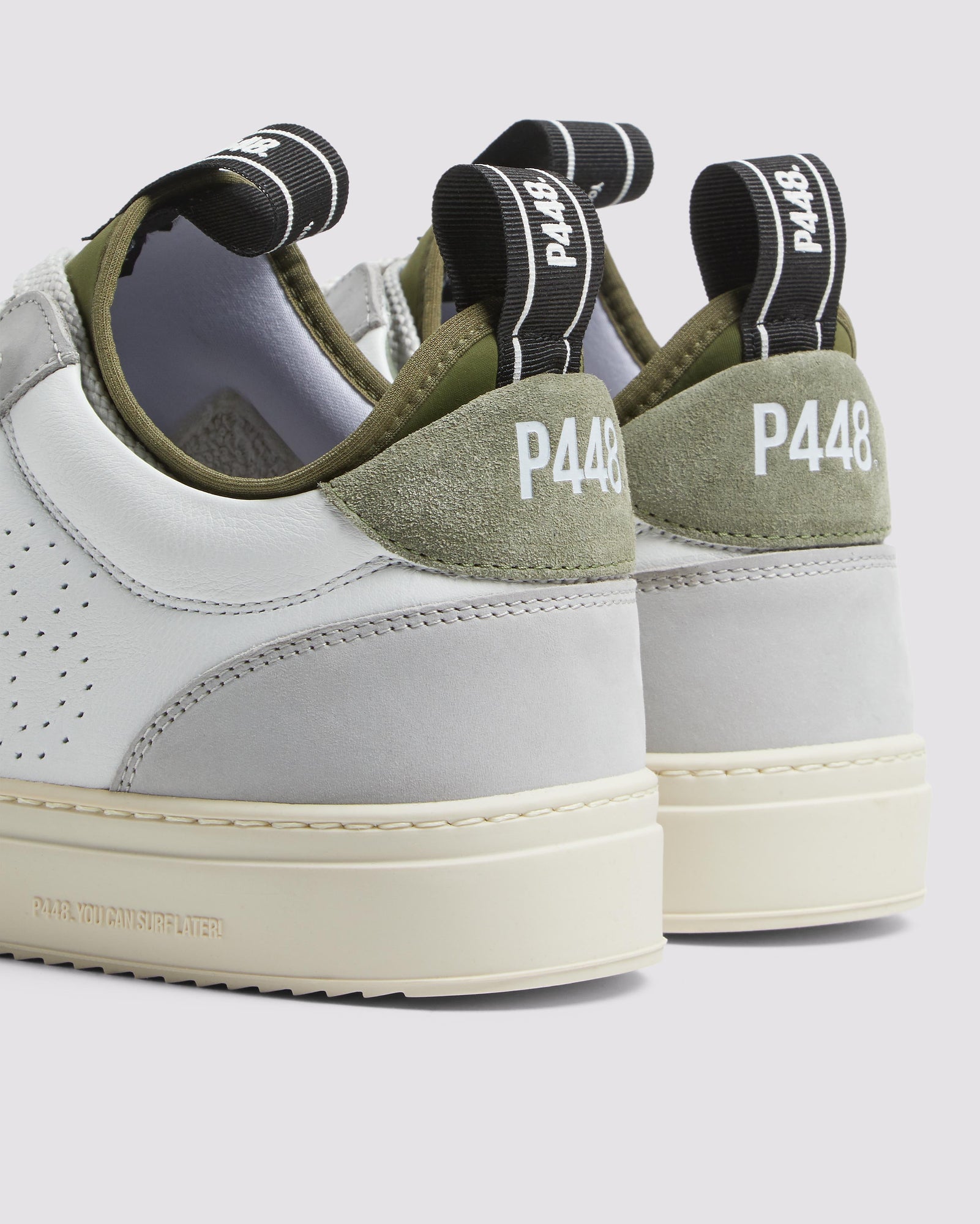 Side angle of white, grey and green sneakers