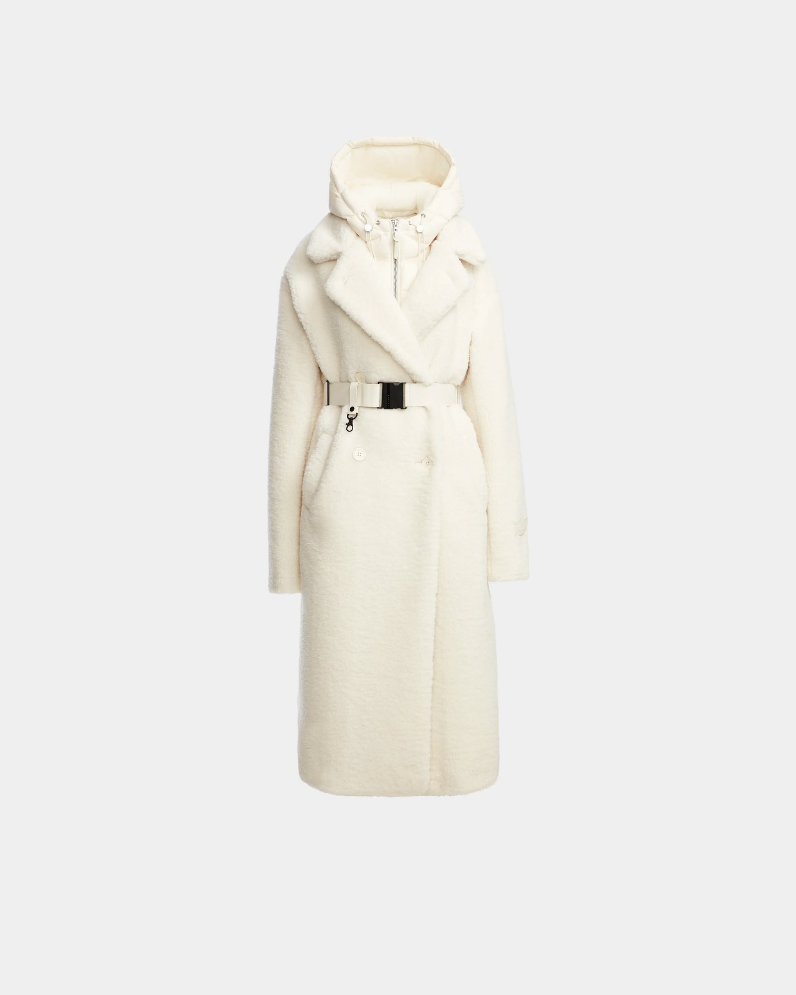 The Rudsak TINA - 8123578 Iceland is a long white women’s teddy coat with a large collar, removable hooded bib, and button details, shown on a plain light gray background.
