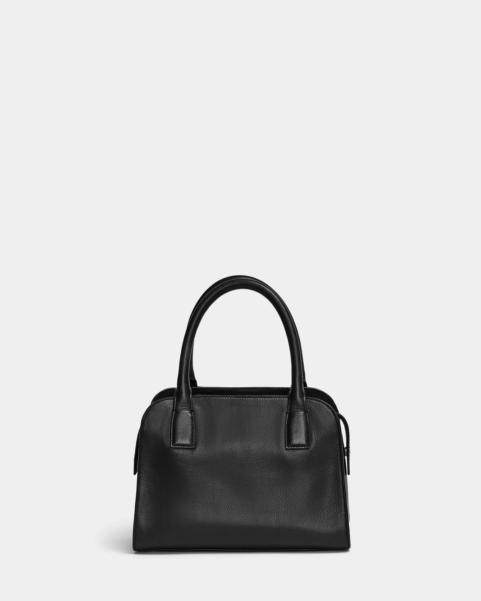 The Rudsak YASMINA - 8324527 Black womens leather tote bag features double handles, minimal stitching, and a structured rectangular shape, shown against a plain light gray background.