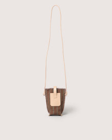 The Graf Lantz compact brown leather crossbody bag features a long, thin tan strap and tan flap closure—ideal for hands-free wear—shown against a plain light background.