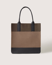 A Graf Lantz rectangular tote bag with two black handles, a brown body, and black trim at the top and bottom is displayed against a plain light background.
