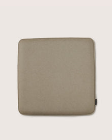 The Graf Lantz square beige Zabuton seat cushion features rounded corners and a subtle fabric texture, making it perfect for meditation. Displayed on a light background.