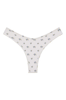 Cream bikini bottom with small blue and yellow floral print throughout.