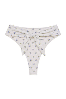Cream bikini bottom with small blue and yellow floral print and tie-up detail at center waist.