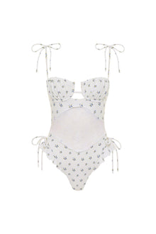 White one-piece swimsuit with small floral print, lace midriff panel, and adjustable tie shoulder straps and side ties.