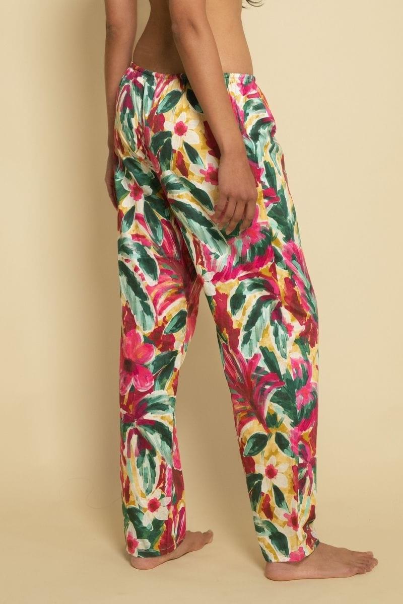 Wide-leg pants with red, yellow, pink, and green floral print and drawstring waist.