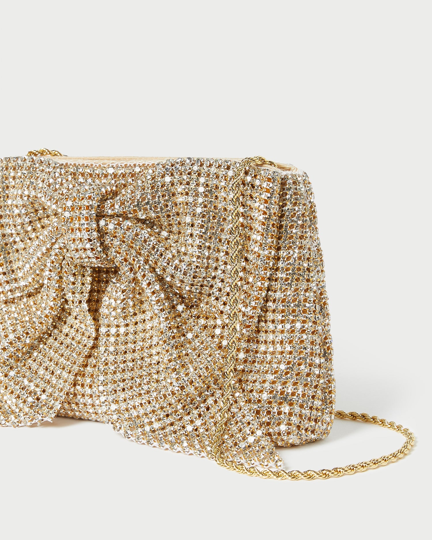 Jolene Gold Diamante Bow Clutch in gold diamante