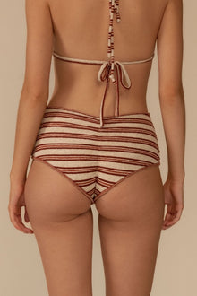 Striped bikini bottom in cream and burgundy with horizontal stripes and tie back closure.