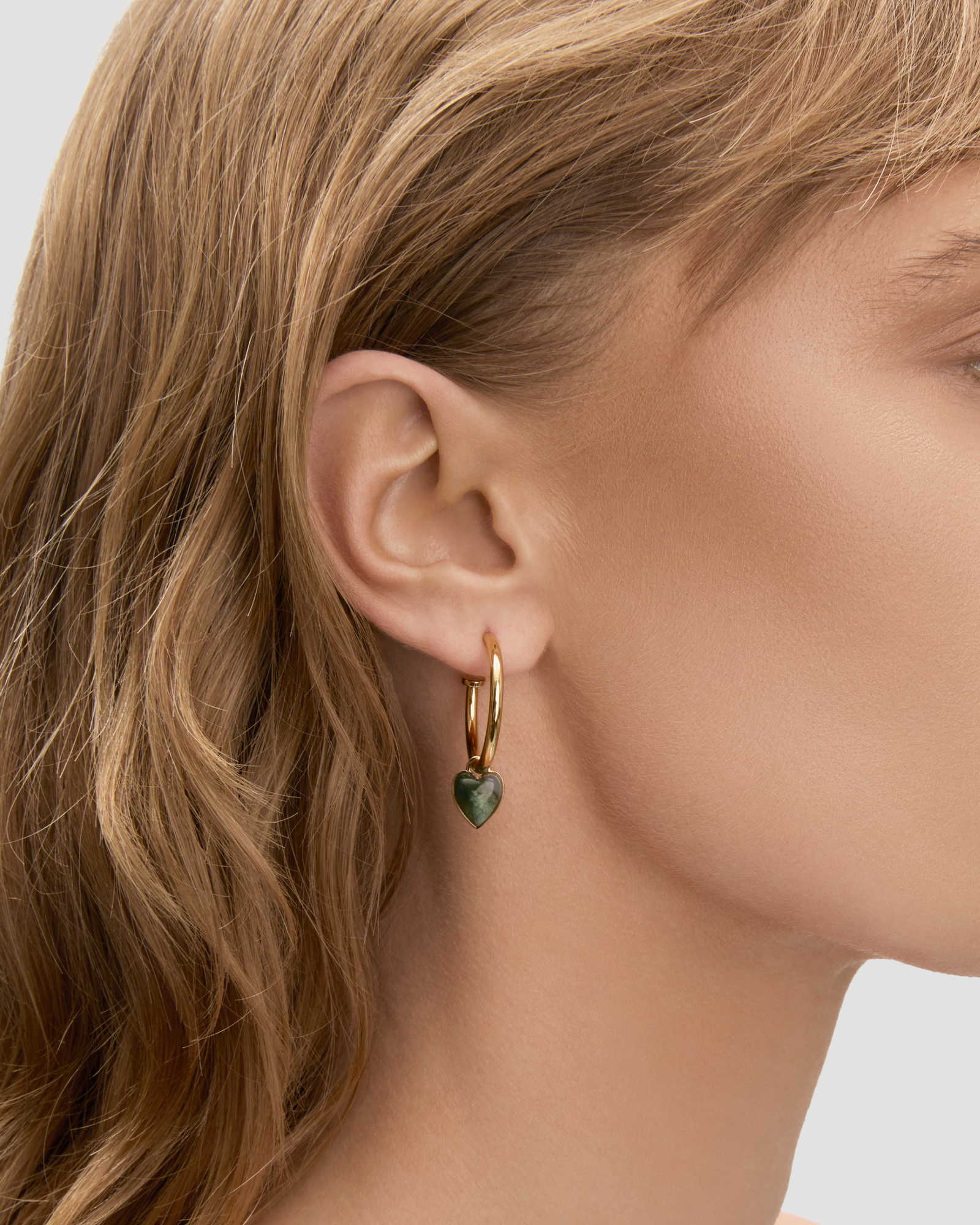 Semi-Precious Convertible Heart Huggies earring - close-up detail | gold huggie earrings