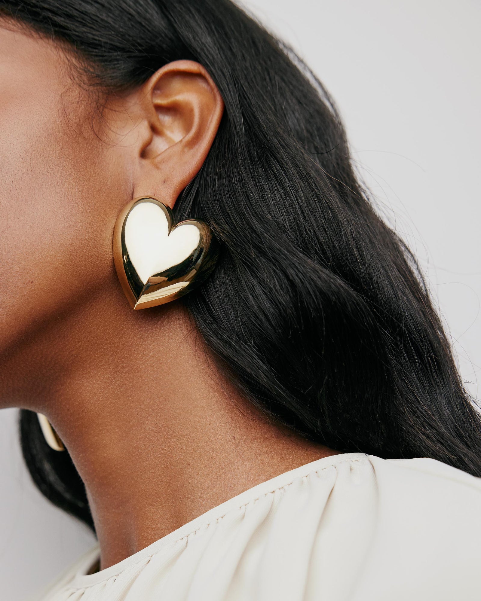 Puffy Heart Earrings earring - close-up detail | womens gold earrings