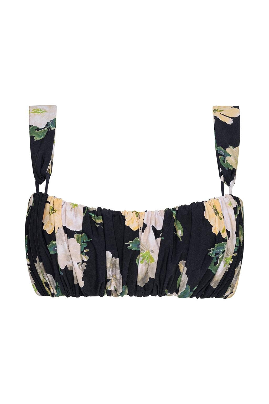 Black bikini top with pale yellow and lavender floral print, ruched front, and adjustable shoulder straps.