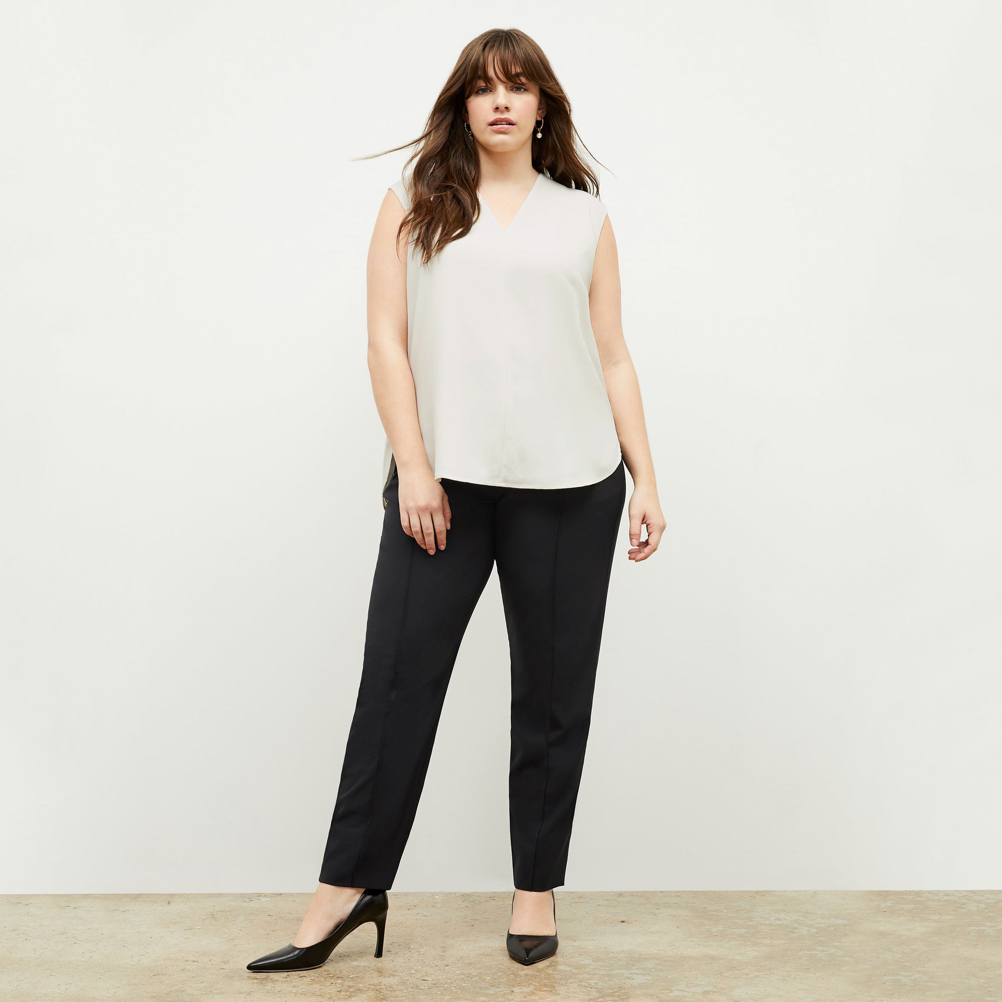 Front image of a woman standing wearing the Colby Jogger in Black | Exclude
