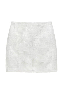 White floral lace micro skirt with textured pattern and fitted waistband.