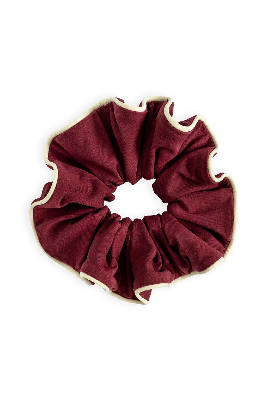 Maroon chunky scrunchie with cream piping trim around edges.