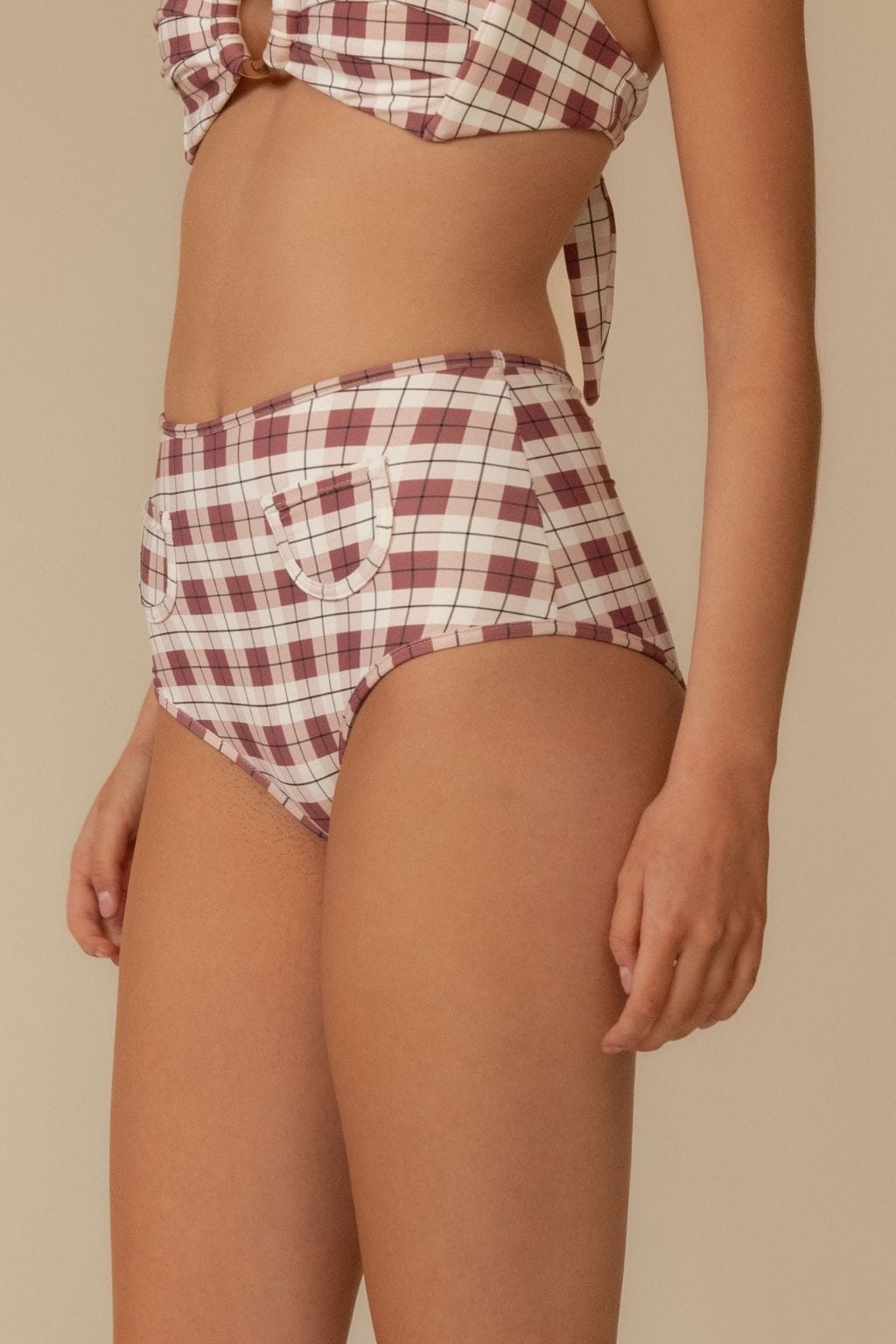 Maroon and cream plaid bikini bottom with decorative pocket detail on the back.
