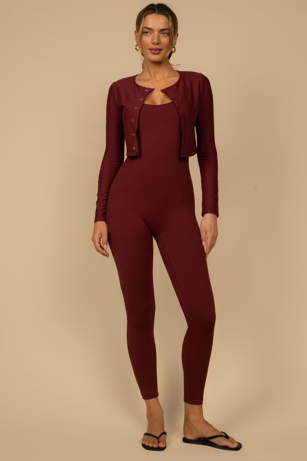 Maroon button-down cardigan worn over matching long-sleeve bodysuit and leggings.