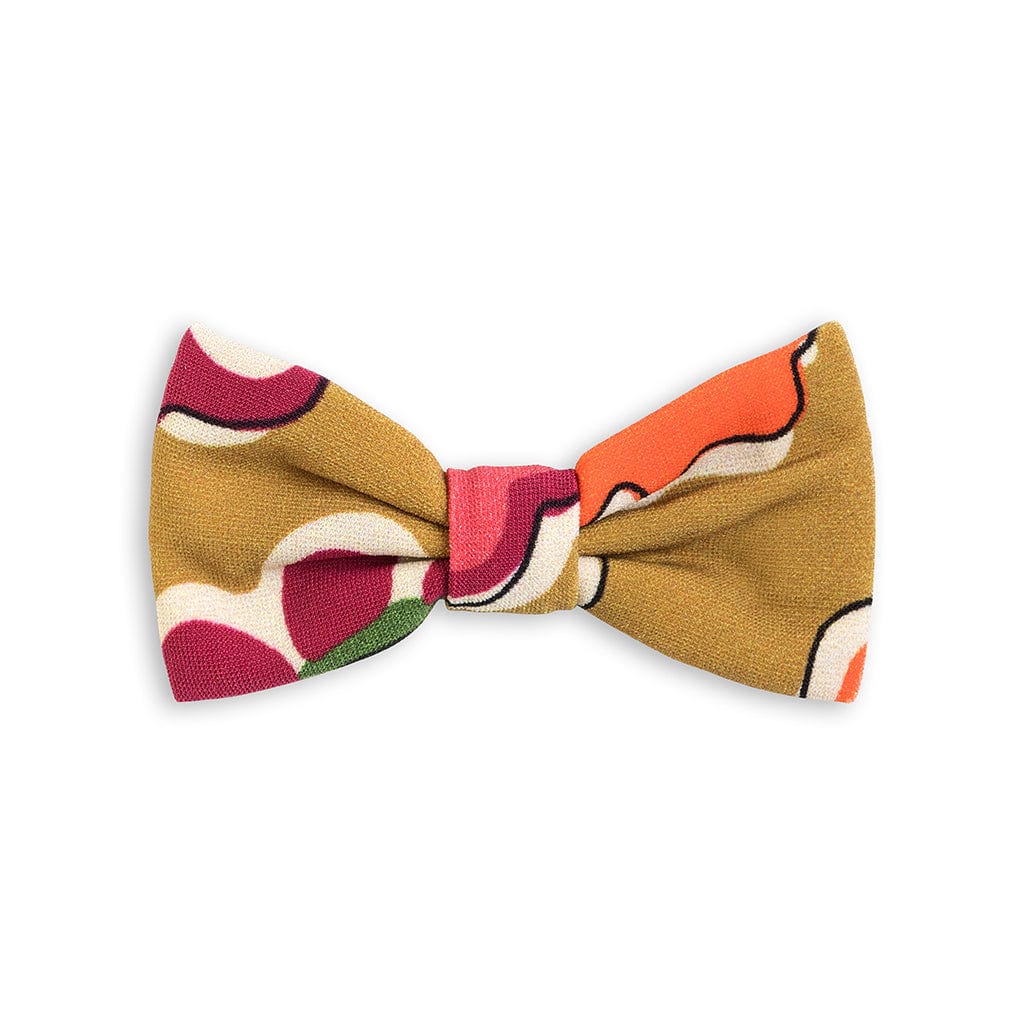 Small bow clip with multicolored floral pattern in gold, burgundy, coral, green, cream, and white.