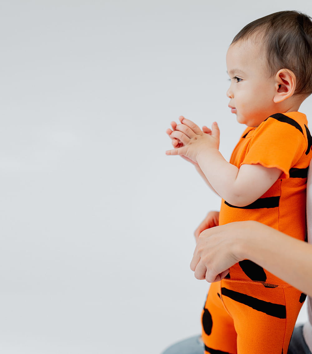 Unisex | Smirks Onesie | Orange Sun