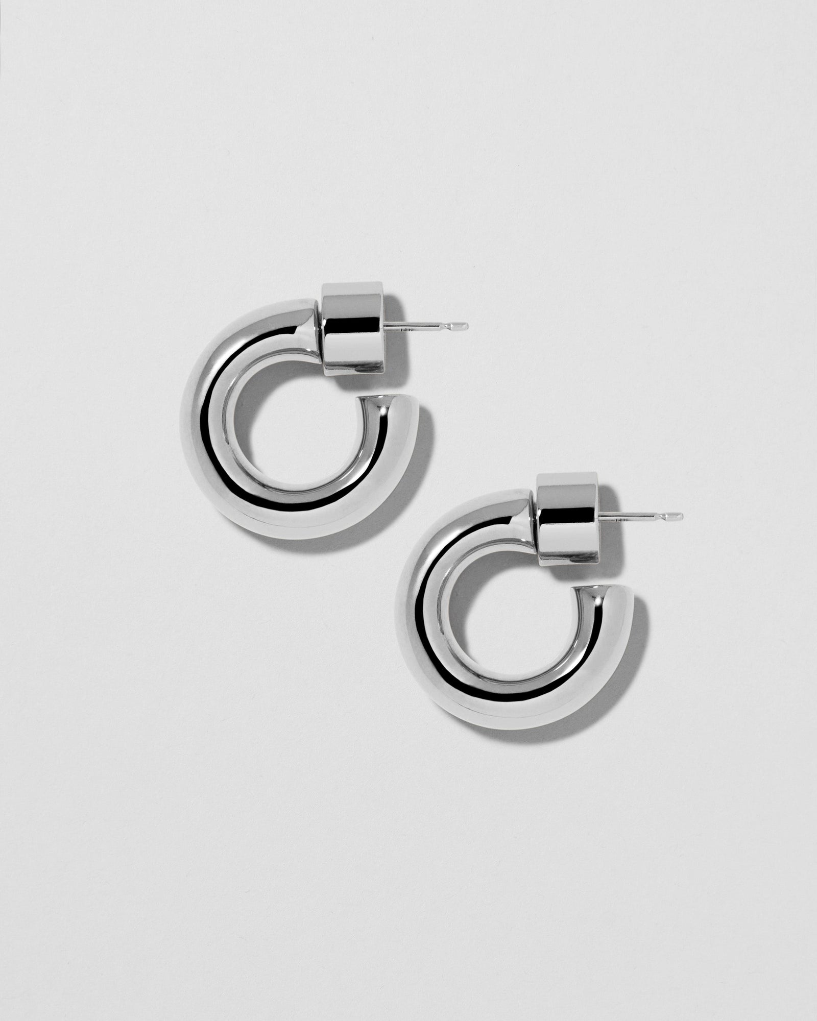 Natasha Micro Huggies earring - product detail shot | gold huggie earrings