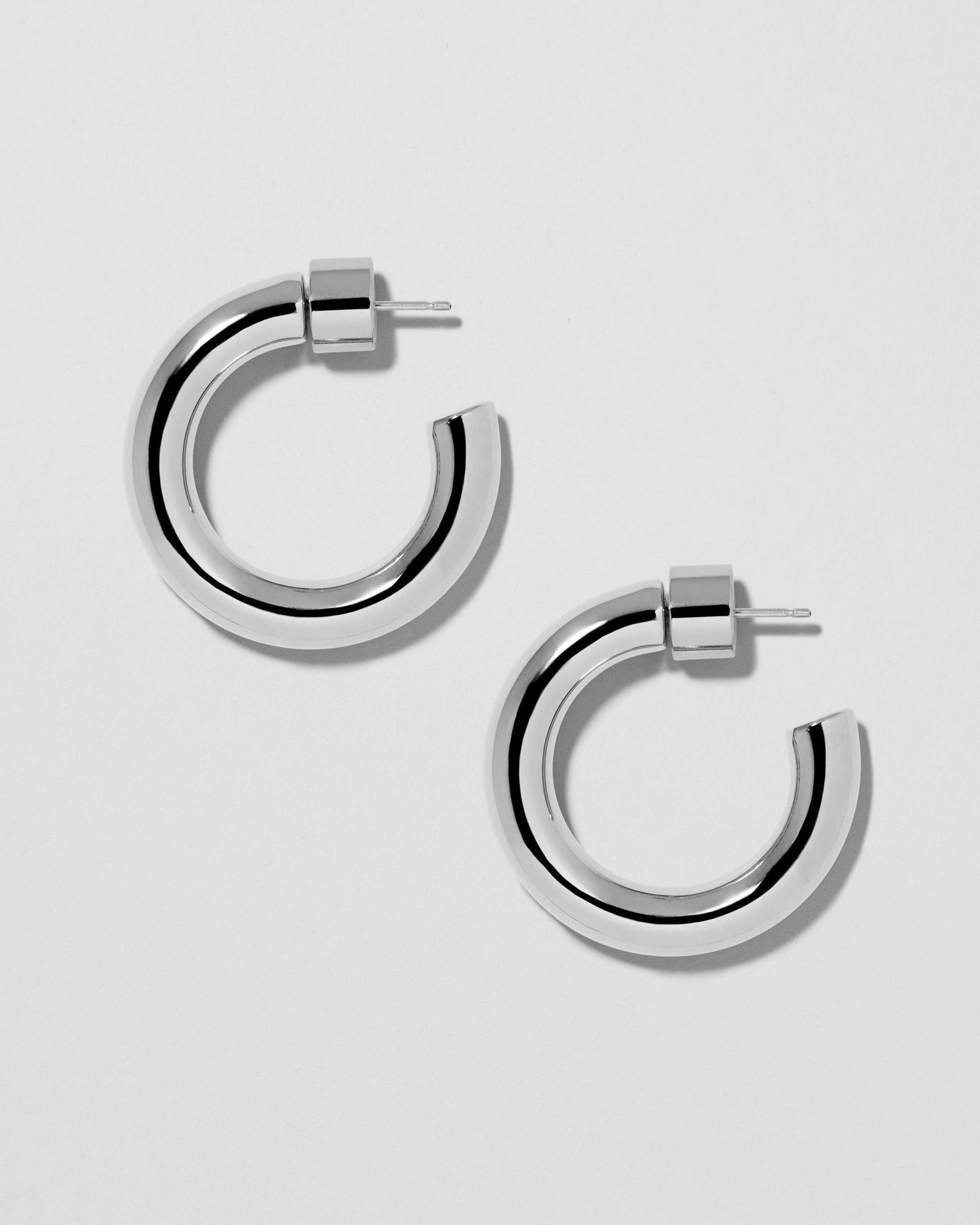 Natasha Huggies earring - product detail shot | gold huggie earrings